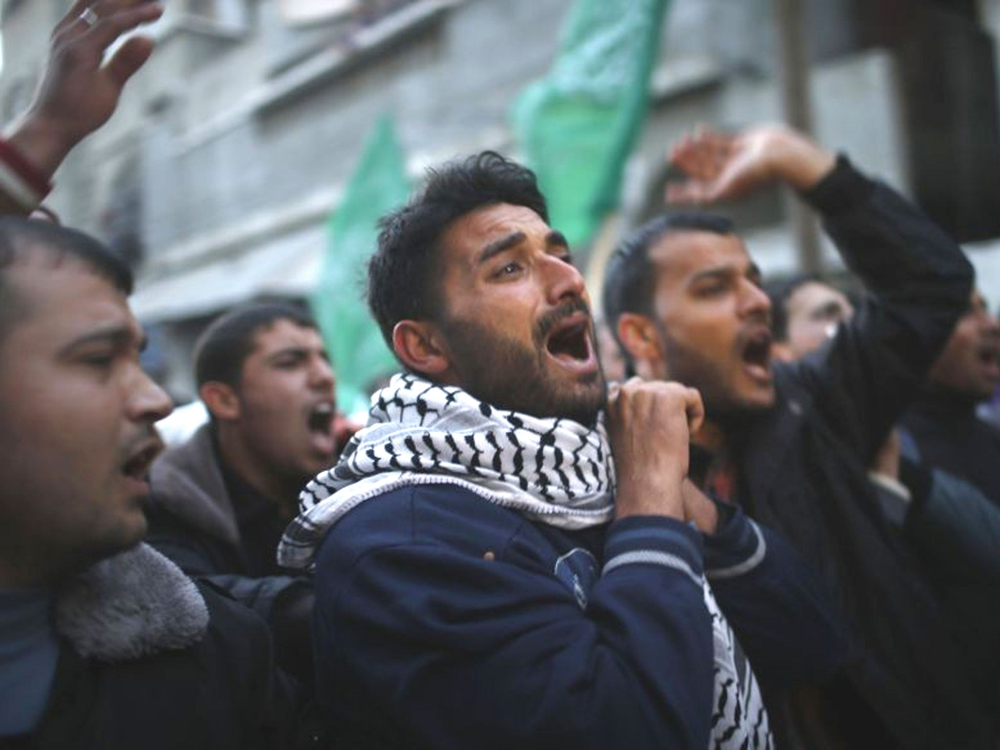 Palestinians carry the body of Bilal Eweda, who medics said was shot by the Israeli troops near the border with Israel, during his funeral in the northern Gaza Strip