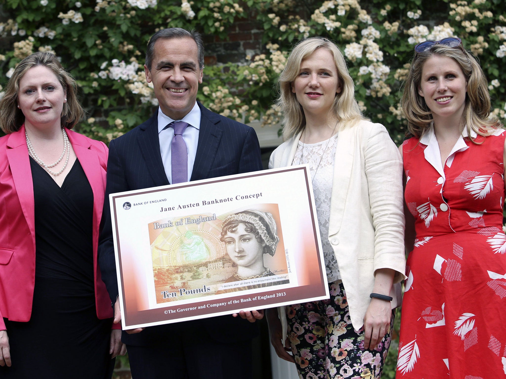 (From left) Mary Macleod, a Conservative MP, Governor of the Bank of England, Mark Carney, Stella Creasy, a Labour MP, and Caroline Criado-Perez, co-founder of the Women's Room, pose at the Jane Austen House Museum on July 24, 2013.