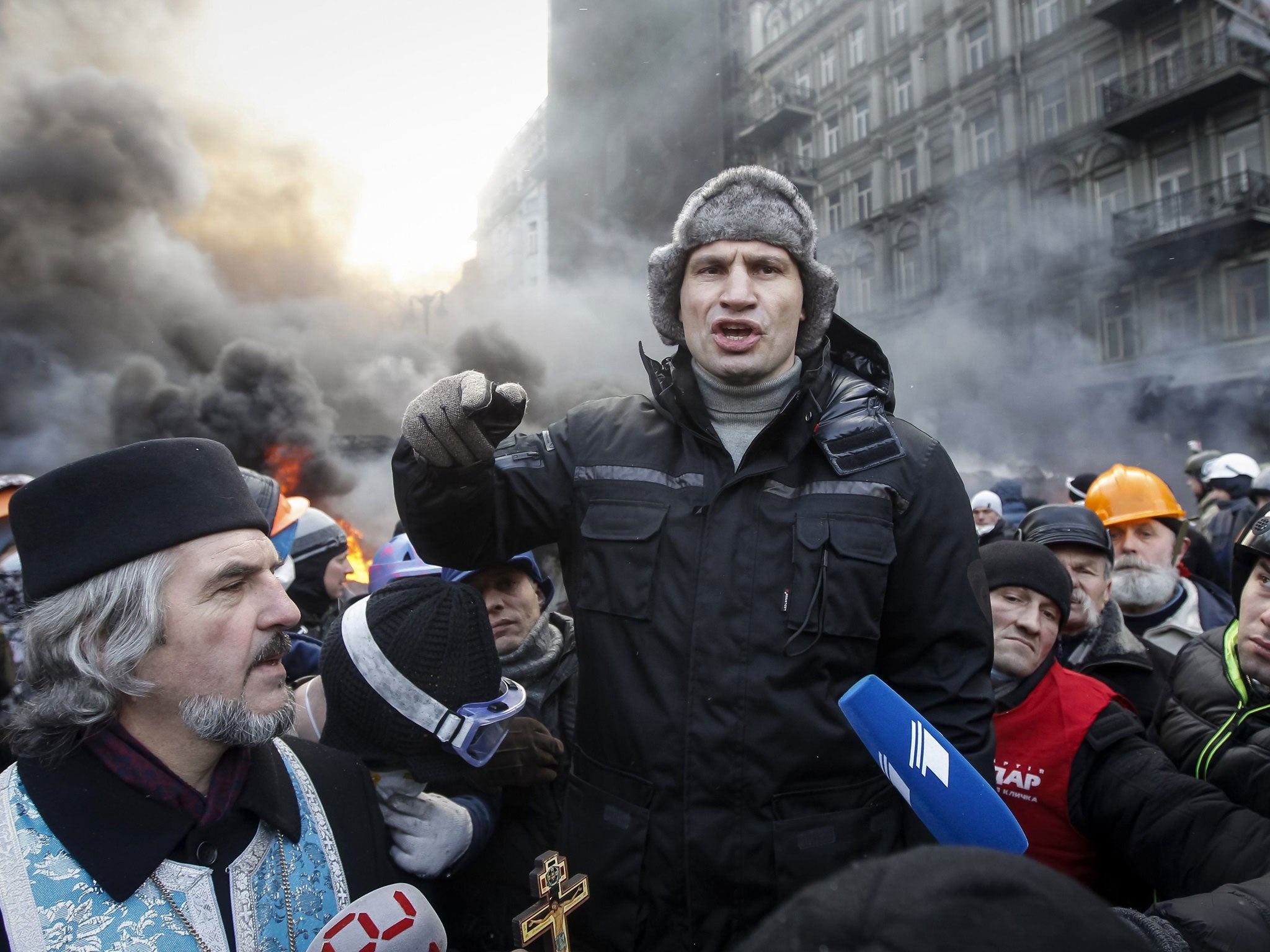 Klitschko talking with pro-European integration protesters at the site of clashes with riot police in Kiev in January 2014 (Reuters)