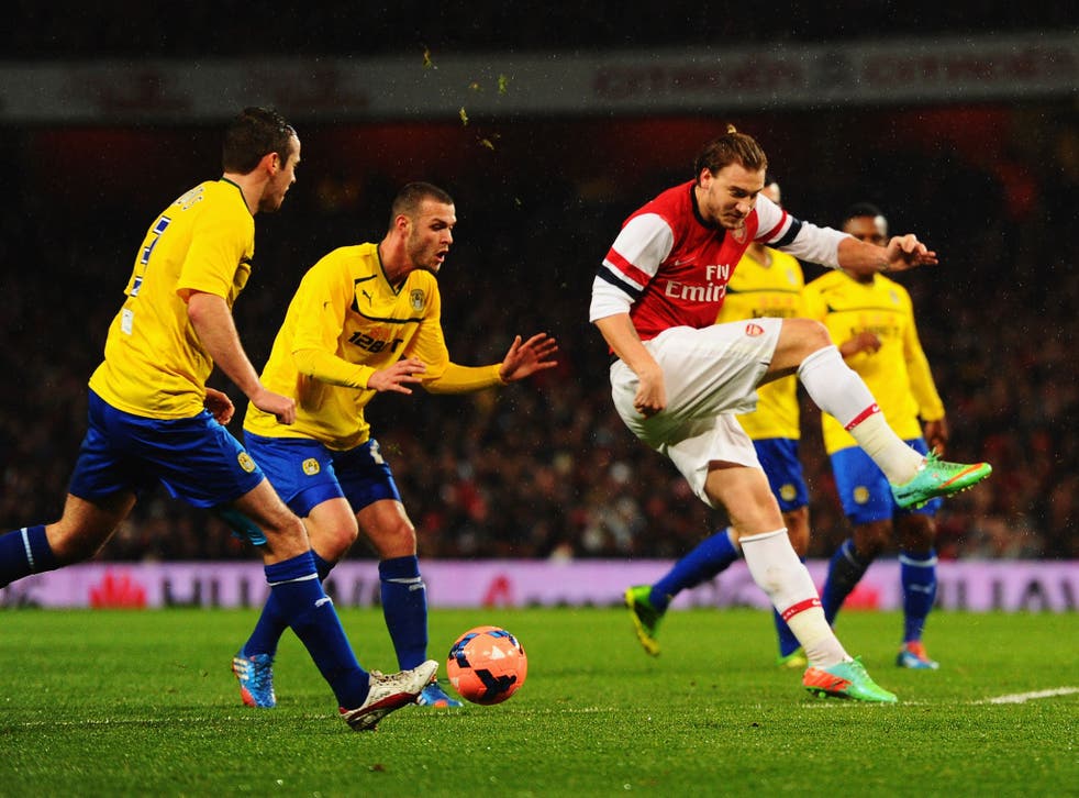 Nicklas Bendtner of Arsenal misses his kick against Coventry last month