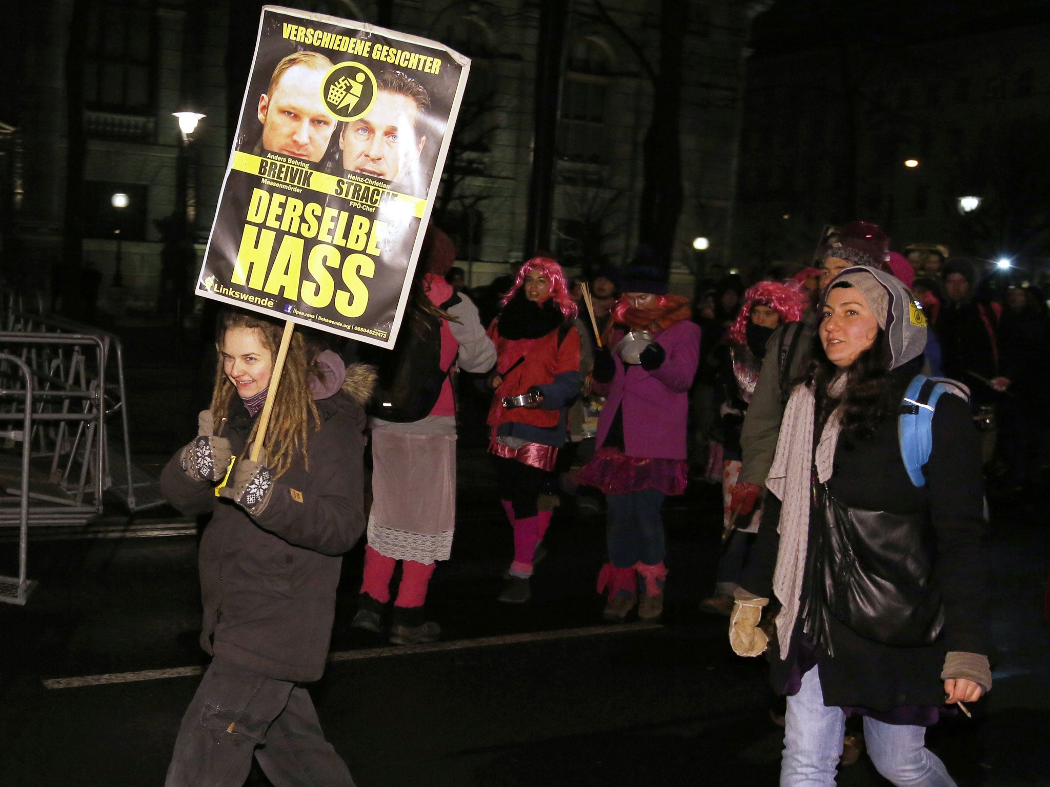 People take part in a protest against the staging of an annual ball hosted by an Austrian extreme right party in the centre of Vienna on January 24, 2014