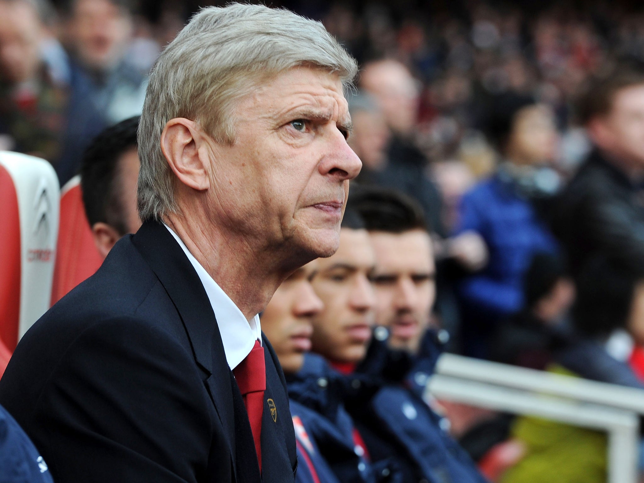 Arsene Wenger looks on from the Arsenal bench