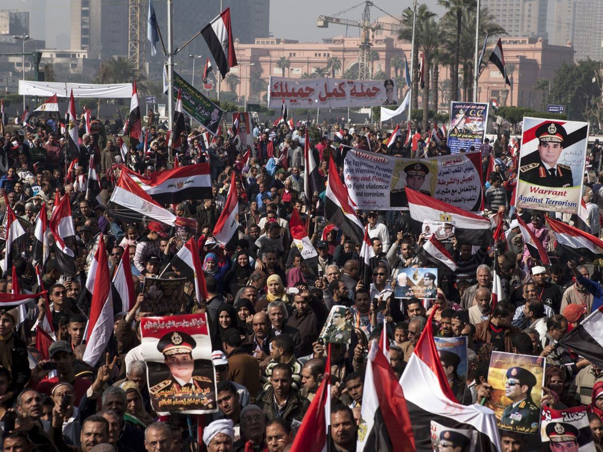Supporters of Egyptian Defense Minister General Abdel Fattah al-Sisi gather in Tahrir Square to celebrate the third anniversary of Egypt's 2011 uprising on 25 January 2014 in Cairo, Egypt.