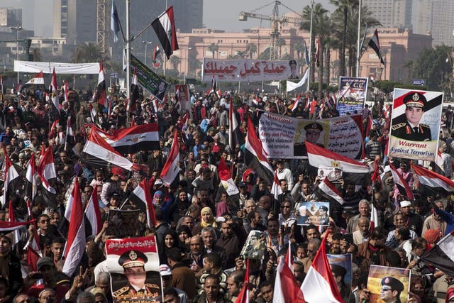 Supporters of Egyptian Defense Minister General Abdel Fattah al-Sisi gather in Tahrir Square to celebrate the third anniversary of Egypt's 2011 uprising on 25 January 2014 in Cairo, Egypt. 