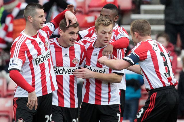 Charis Mavrias celebrates with his Sunderland team-mates after scoring against Kidderminster