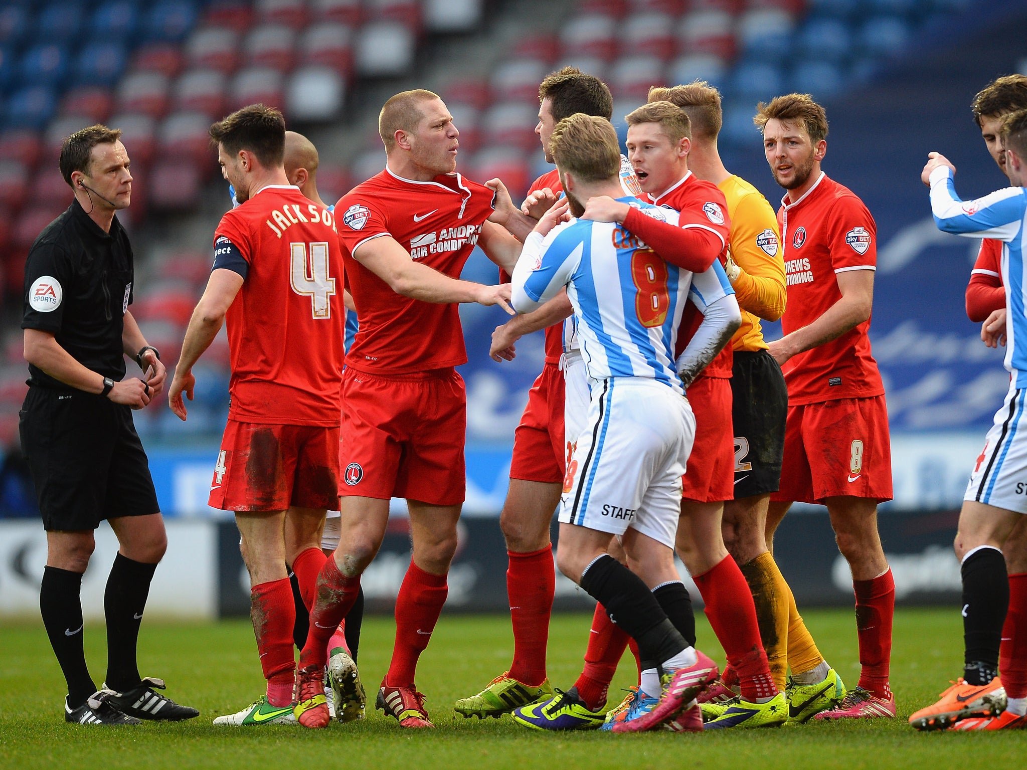 Charlton and Huddersfield player clash during the FA Cup fourth round fixture