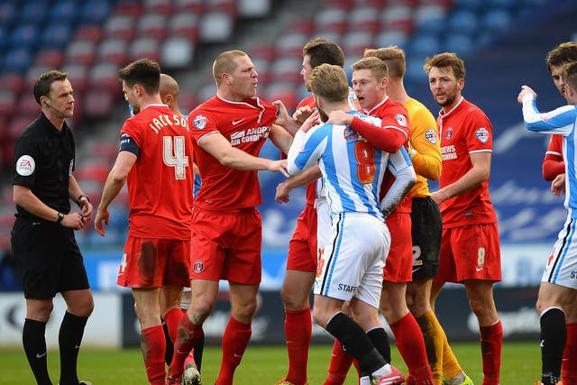 Charlton and Huddersfield player clash during the FA Cup fourth round fixture