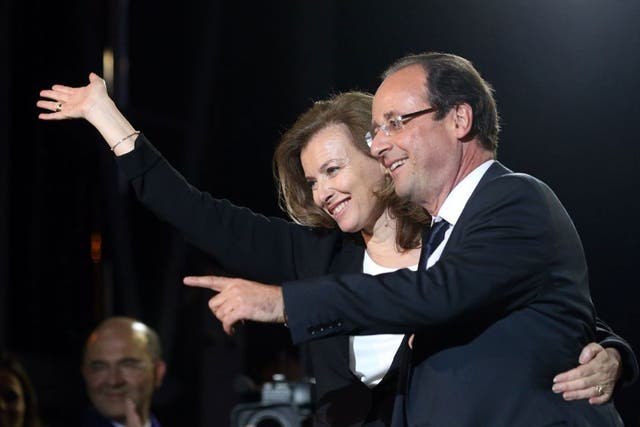 Francois Hollande and his then partner Valerie Trierweiler greet thousands of gathered supporters at Place de la Bastille after victory in French Presidential Elections on May, 2012 