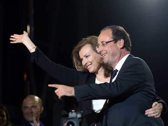Francois Hollande and his then partner Valerie Trierweiler greet thousands of gathered supporters at Place de la Bastille after victory in French Presidential Elections on May, 2012 