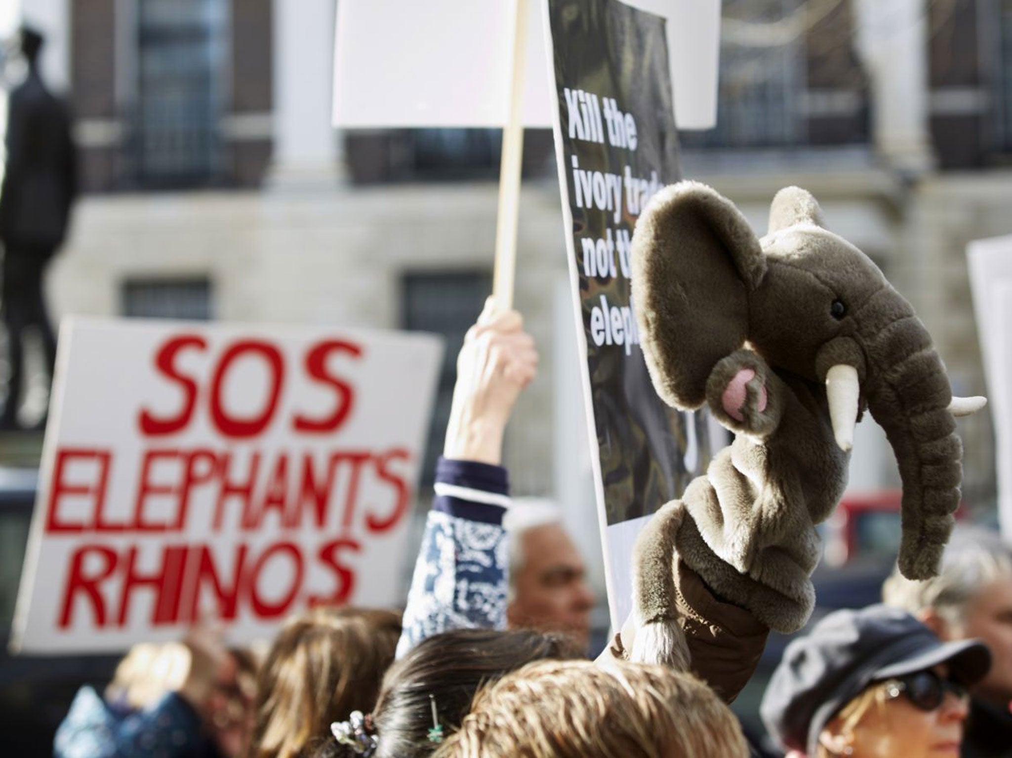 Protesters gather outside the Chinese embassy in London