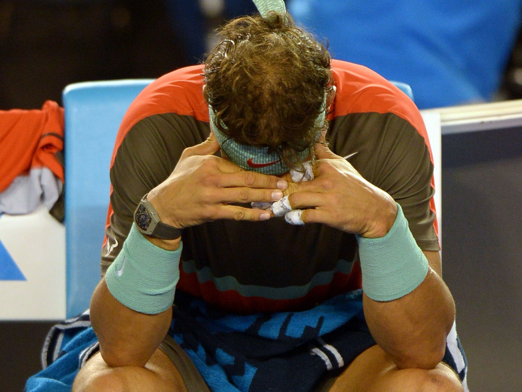 A pained Rafael Nadal reacts between games