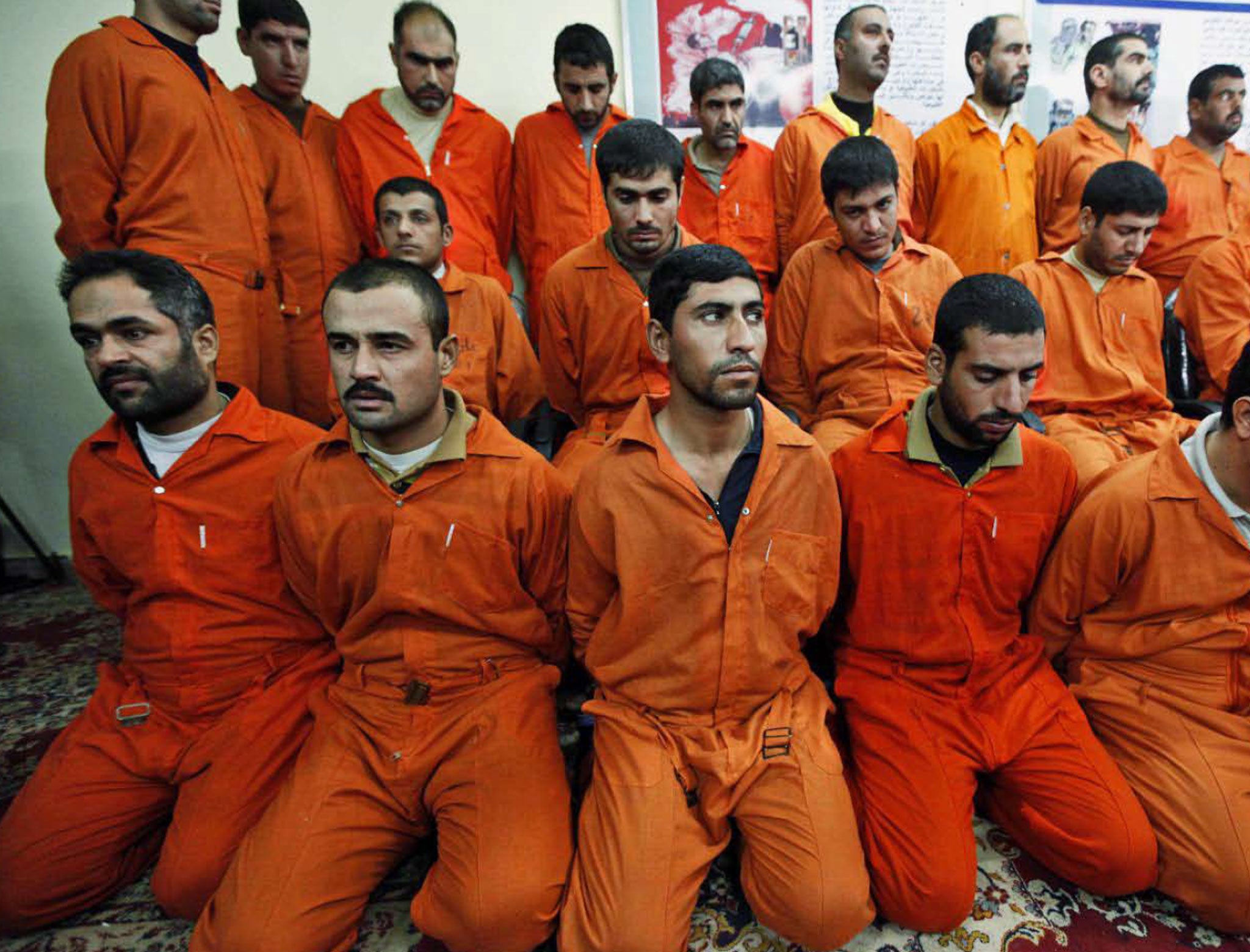 Suspects accused of having links to al-Qa’ida are shown to the press at a Baghdad facility. Post-Saddam, Iraq has executed hundreds of prisoners, many of them following ‘confessions’ before their trials