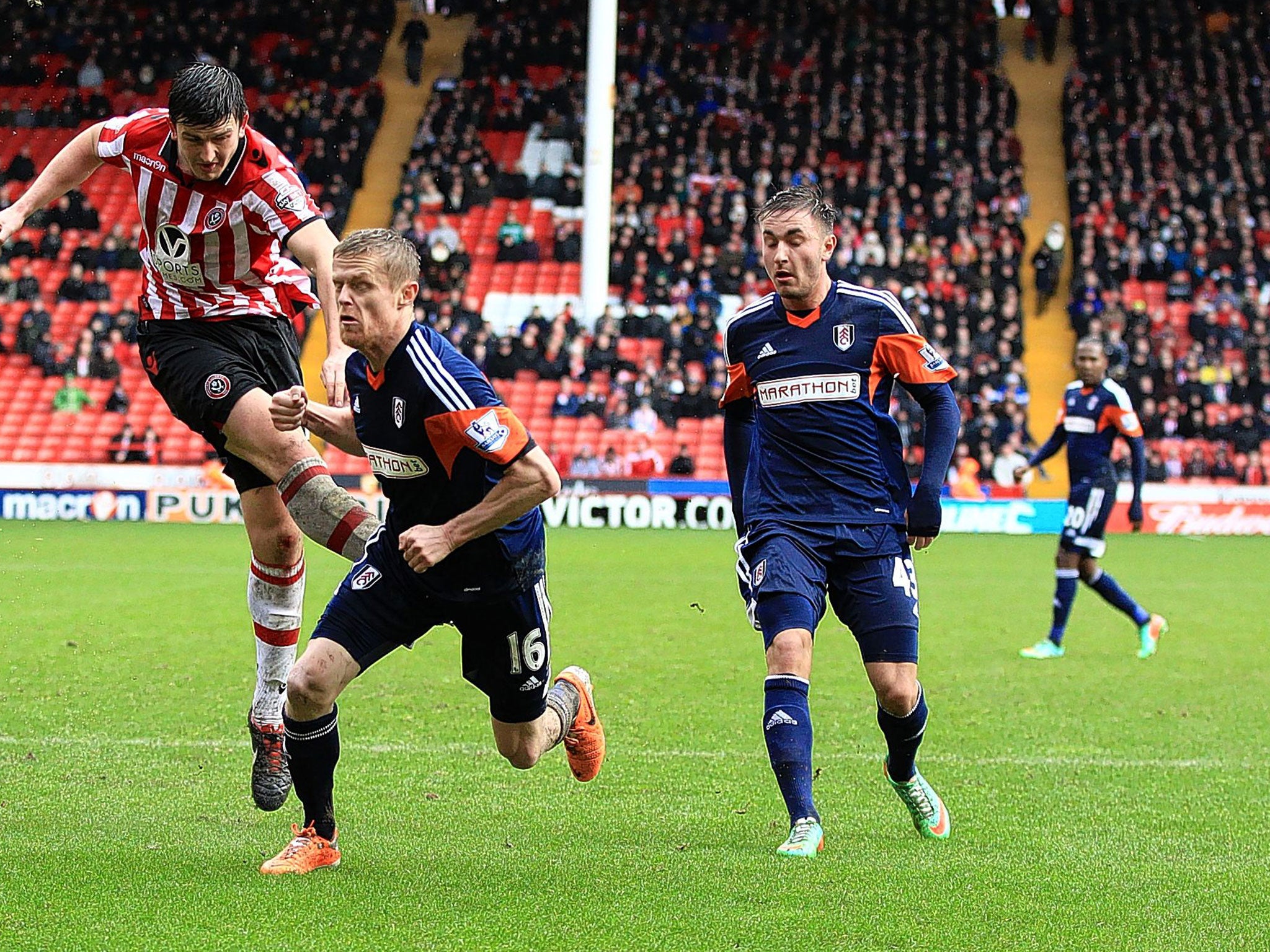 Sheffield United’s Harry Maguire has a shot on goal that is turned in by team-mate Chris Porter