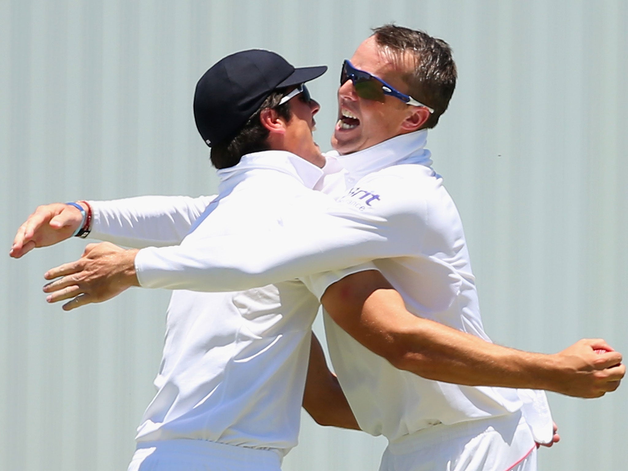 Alastair Cook and Graeme Swann celebrate during the 2013-14 Ashes Series in Australia