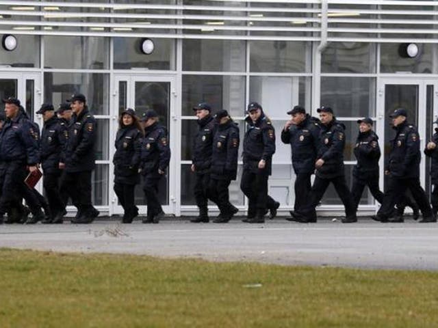 Policemen walk at the Olympic Park in the Adler district of Sochi 18 January, 2014. UK officials are warning more terrorist attacks are “very likely to occur” in Russia either before or during the Olympics. 