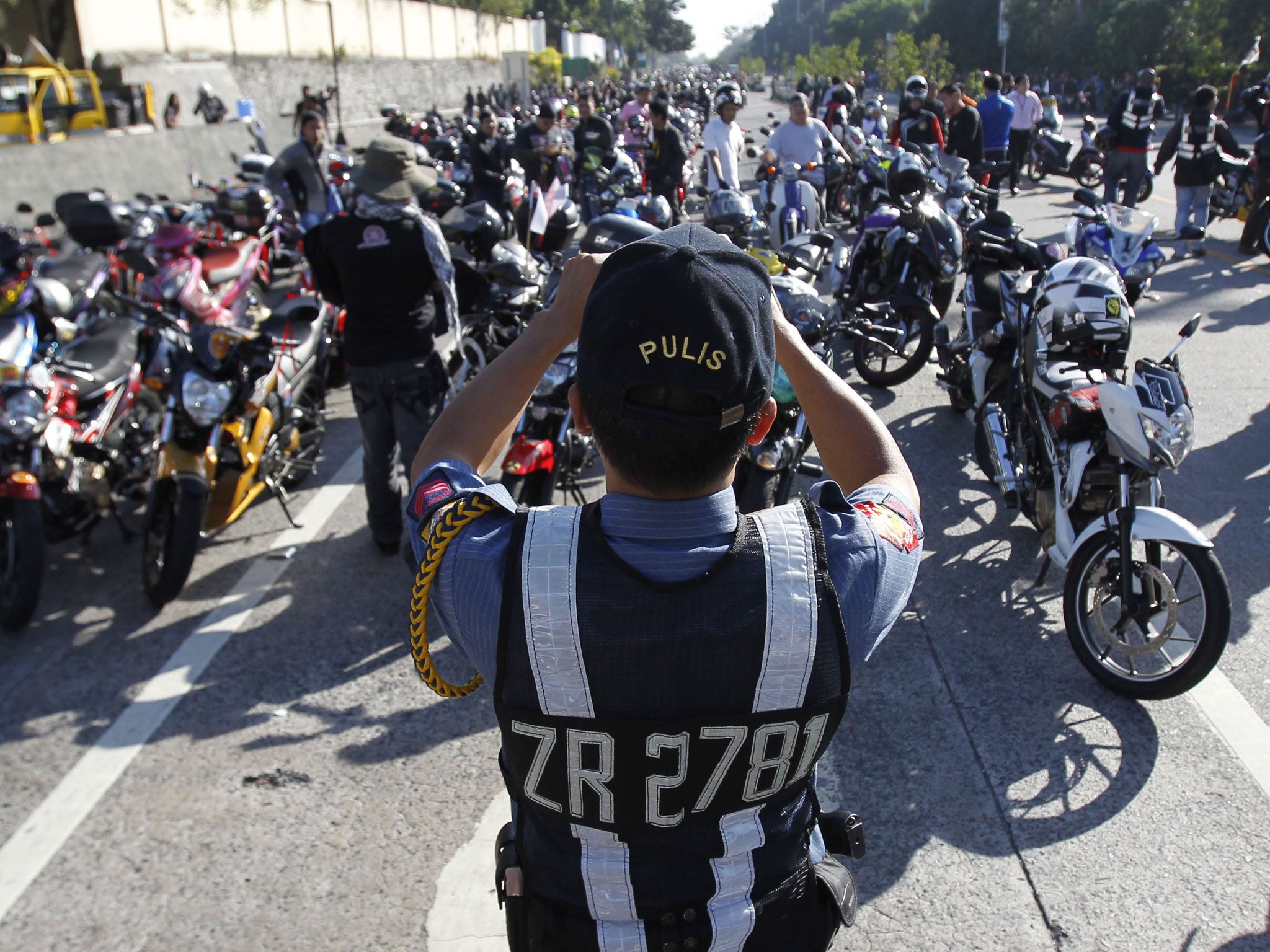 Many workers use motorbikes because they are a cheap and agile transport - able to weave through traffic with ease