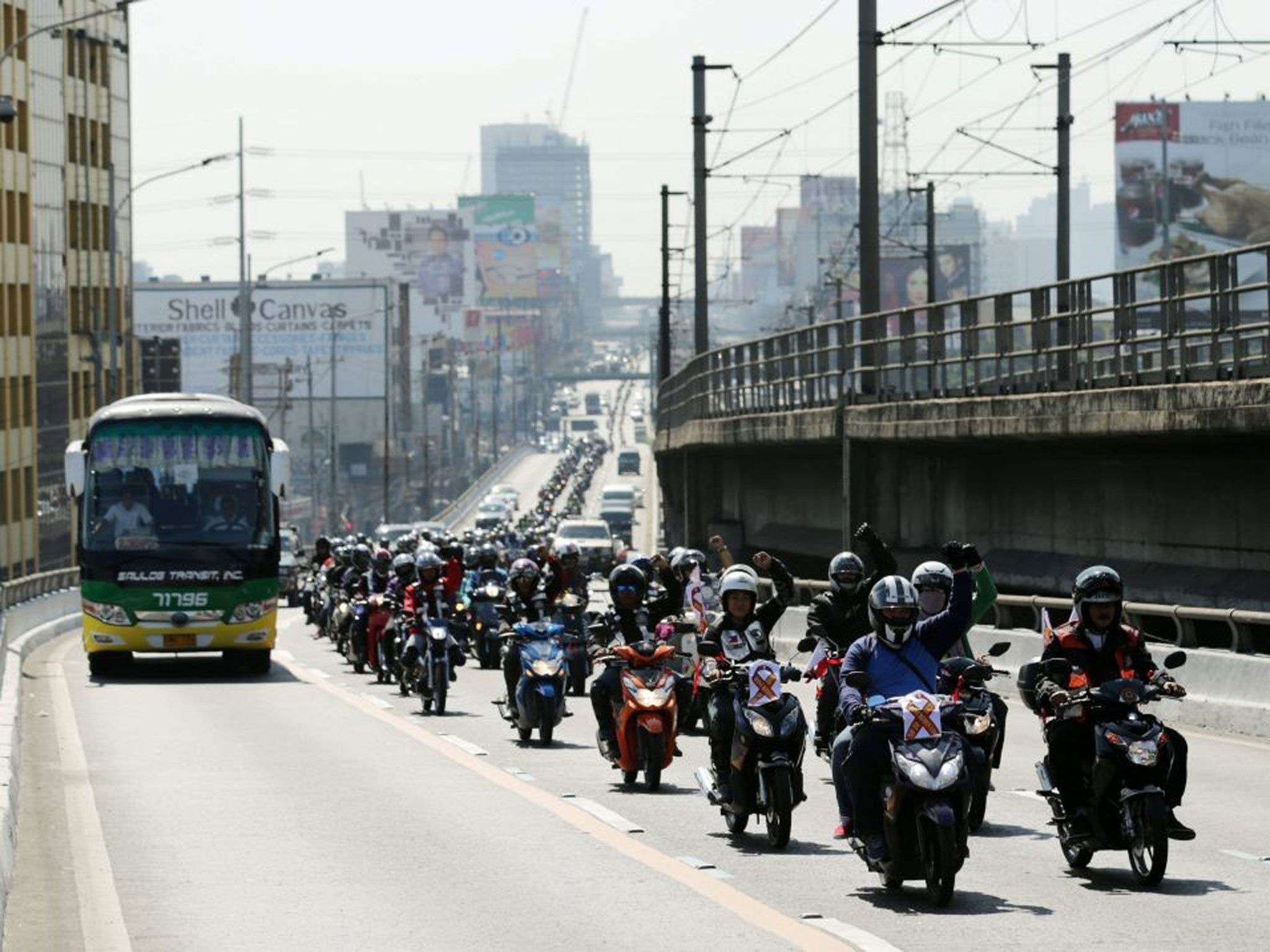 The protesters drove through Quezon City, a district of Manila city