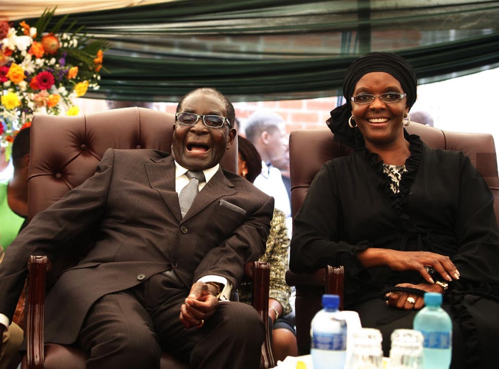 Robert Mugabe ad his wife Grace Mugabe at his sister's funeral. The British government has come under fire for hosting a delegation of Zimbabwean businessmen, some of whom were related to Mugabe's regime