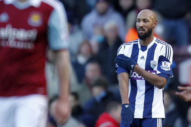 West Bromwich Albion's French striker Nicolas Anelka gestures as he celebrates scoring their second goal against West Ham United