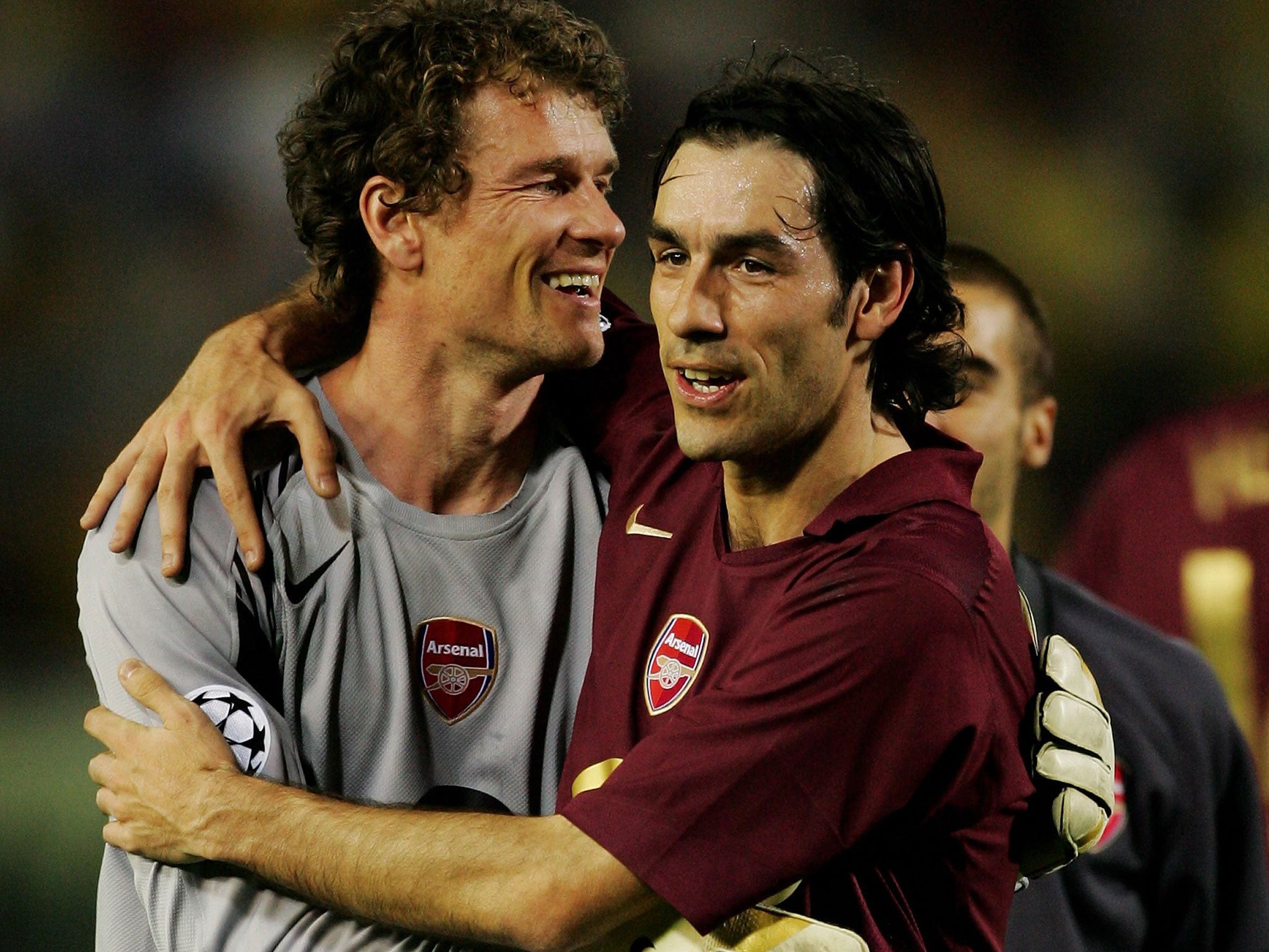 Jens Lehmann (right) celebrates Arsenal progressing to the Champions League final in 2006 with Robert Pires after the semi-final at Villarreal