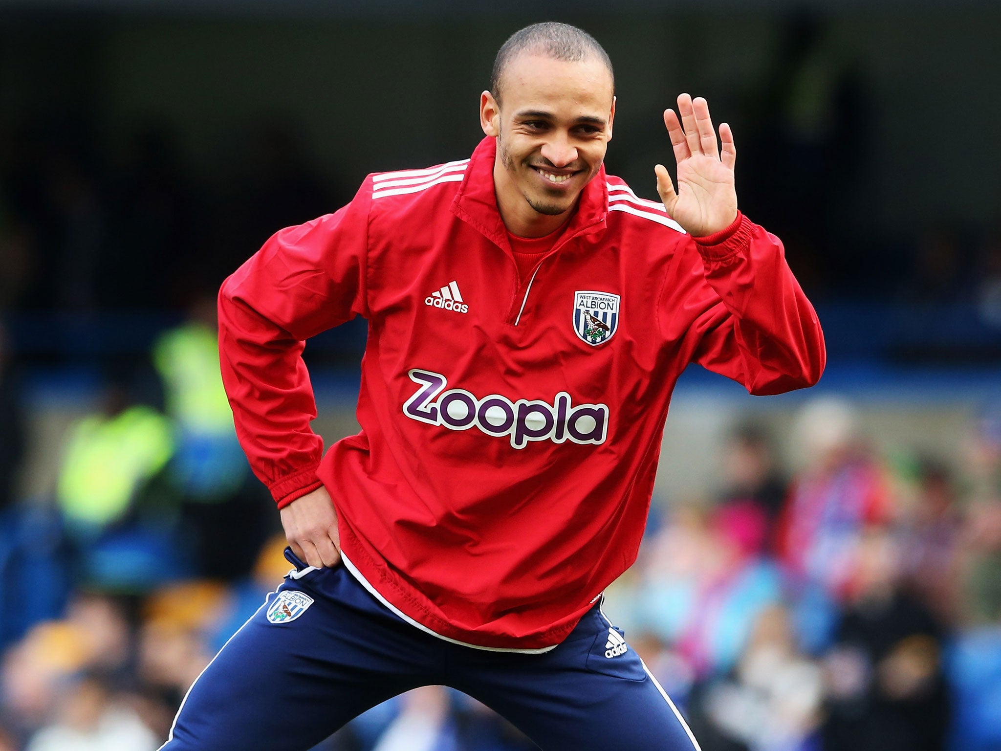 Peter Odemwingie of West Bromwich Albion waves as he warms up prior to the Barclays Premier League match between Chelsea and West Bromwich Albion