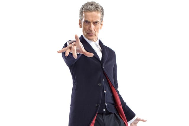 Peter Capaldi as The Doctor in a dark blue Crombie coat with red lining