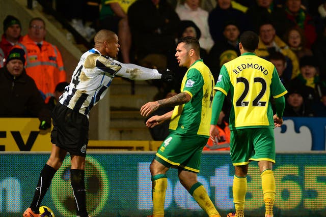 Loic Remy of Newcastle United and Bradley Johnson of Norwich City come to blows 
