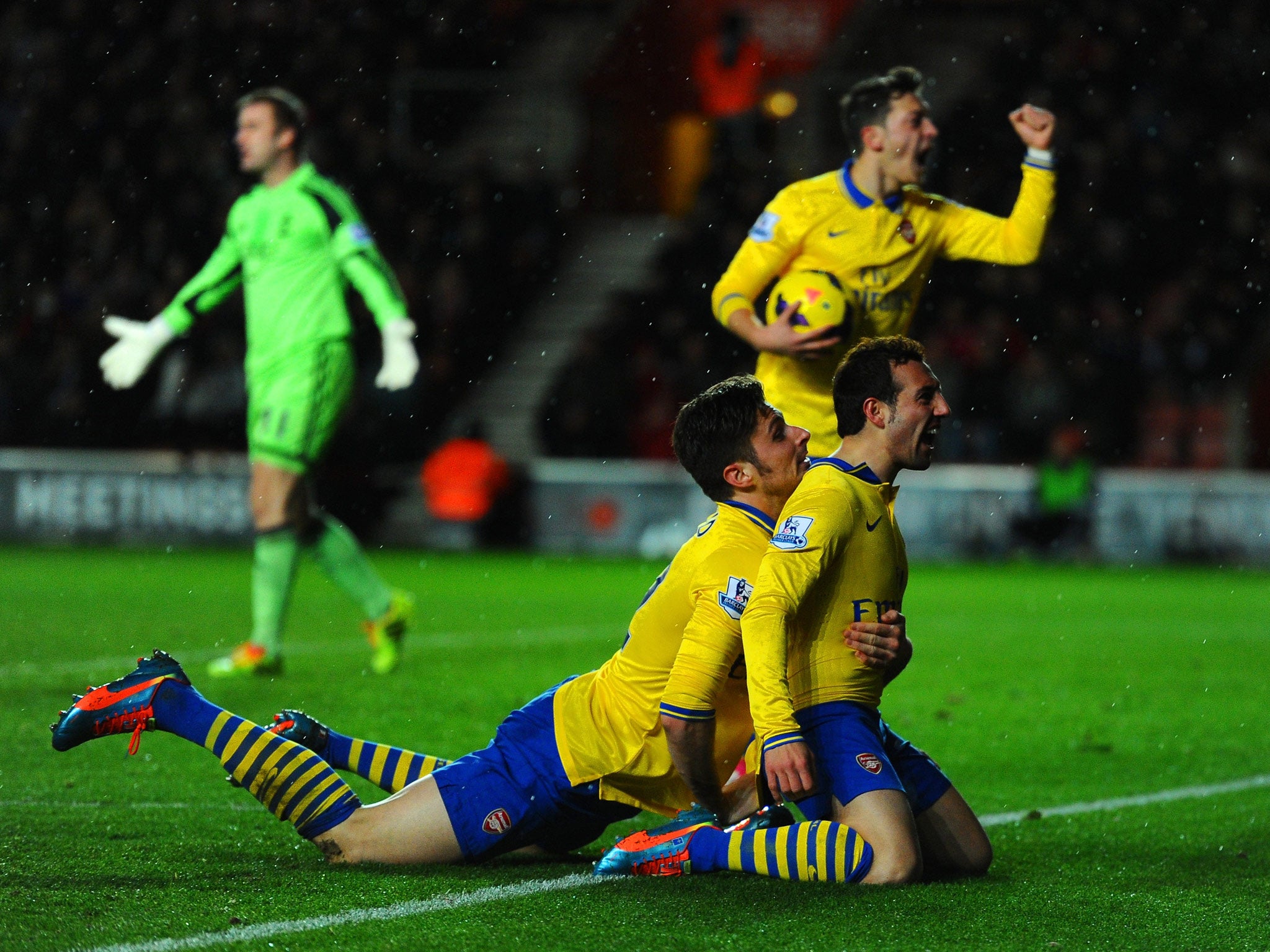 Santi Cazorla of Arsenal celebrates scoring their second goal with Olivier Giroud