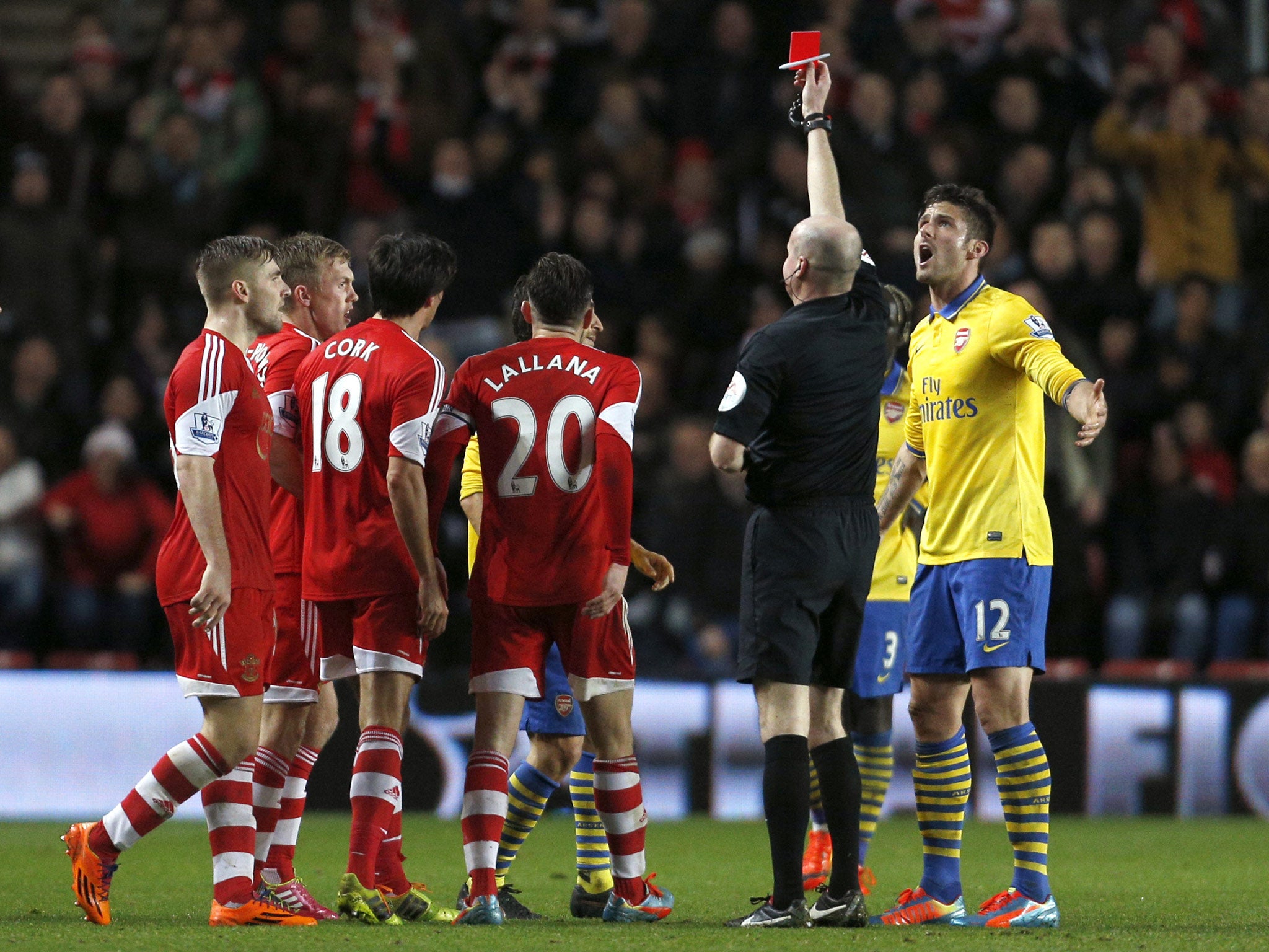 Referee Lee Mason shows the red card to Arsenal's French midfielder Mathieu Flamini against Southampton