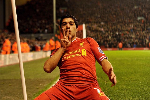 Luis Suarez of Liverpool celebrates his goal 