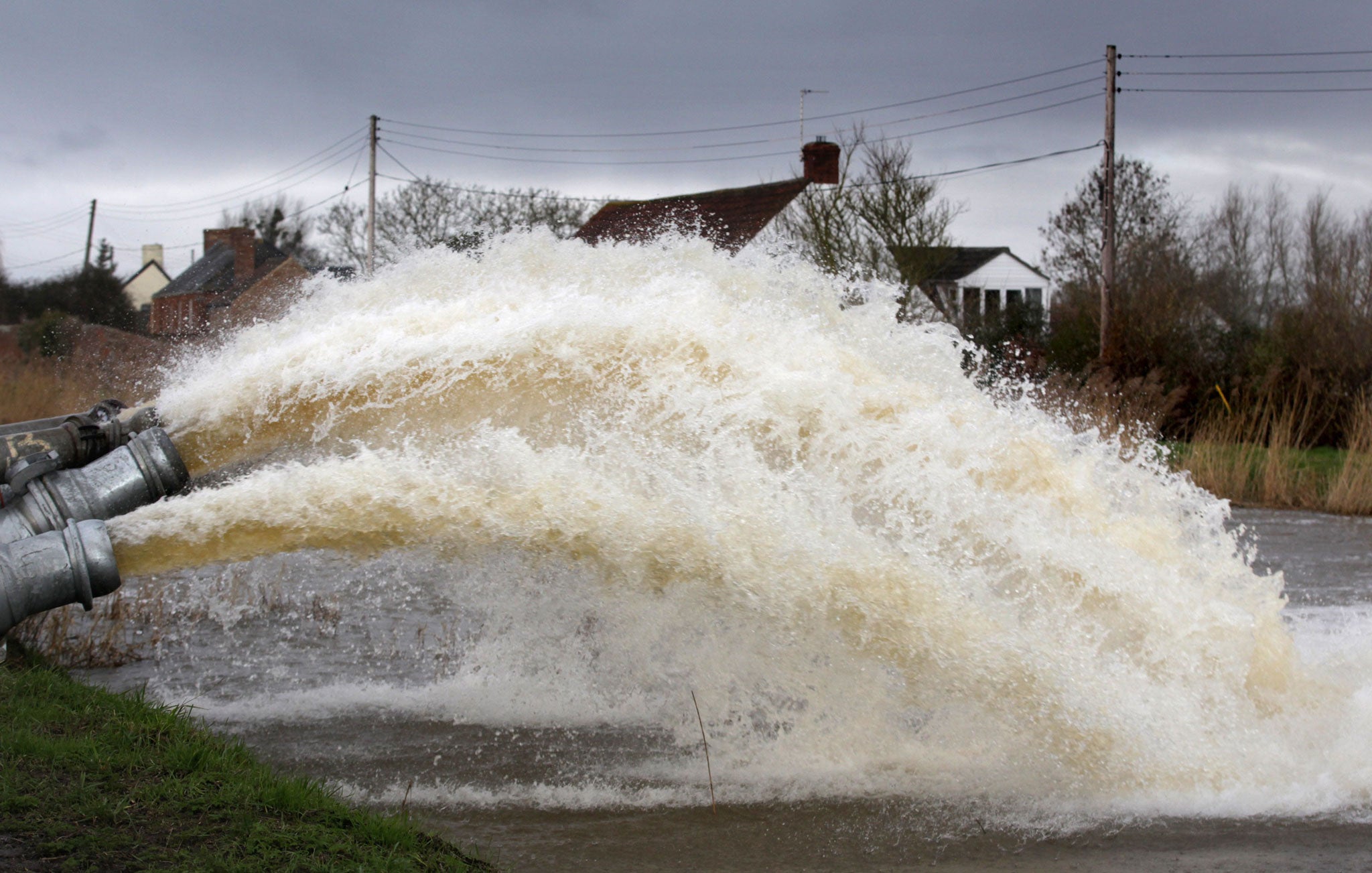 Flood water is pumped into the River Parrott from the Somerset Levels at Moorland on 28 January. Britain was warned to prepare for more storms arriving at the end of the week