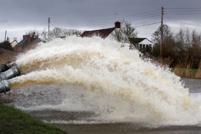 Flood water is pumped into the River Parrott from the Somerset Levels at Moorland on 28 January. Britain was warned to prepare for more storms arriving at the end of the week