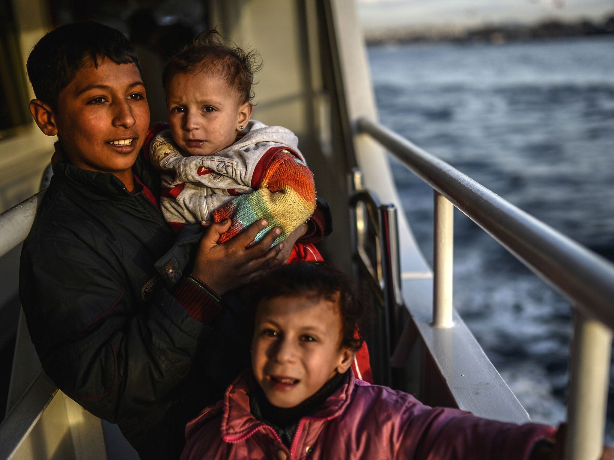 A Syrian refugee family from Aleppo crosses the Bosphorus from Uskudar to the European side of Istanbul