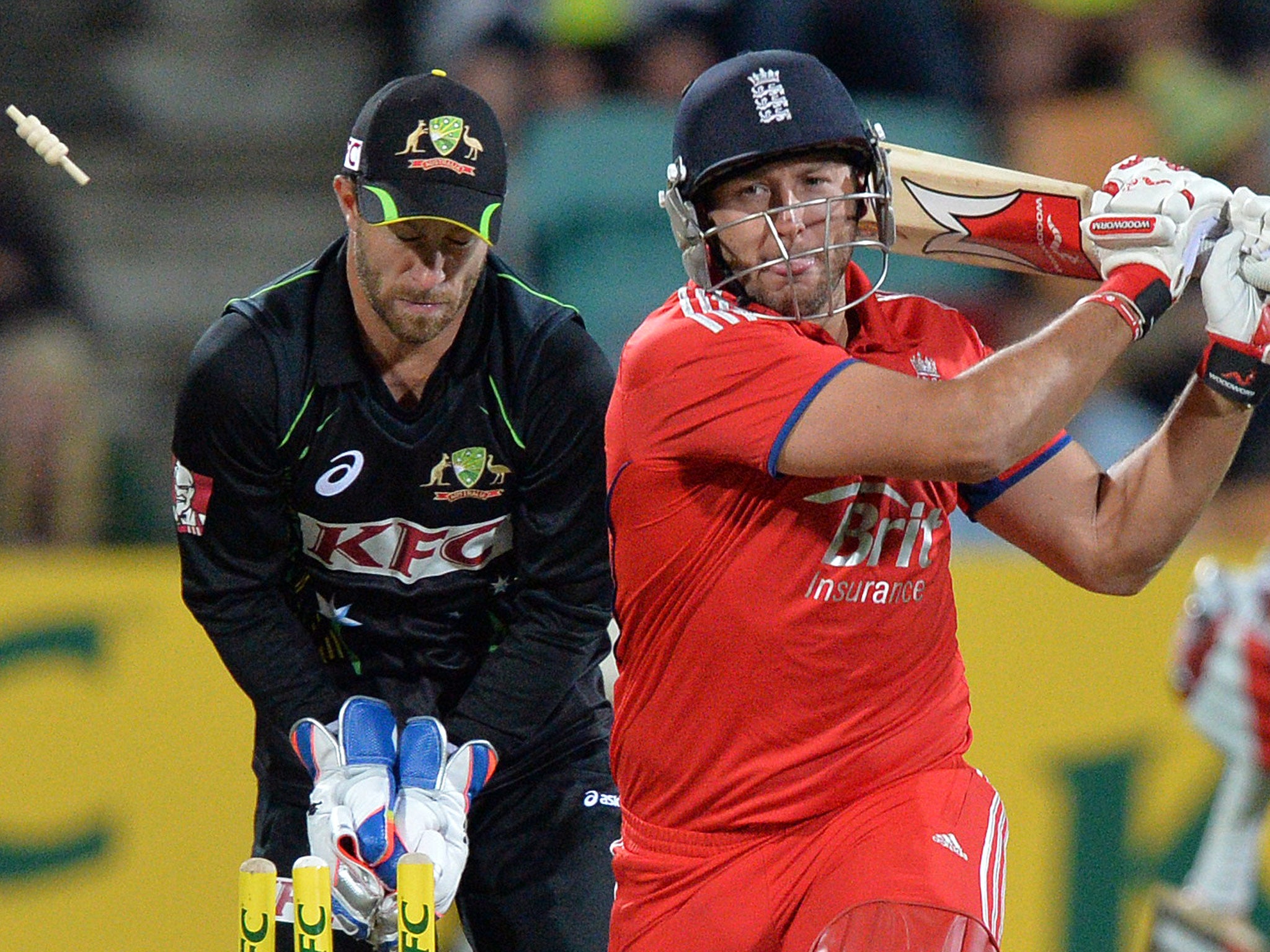 England's batsman Tim Bresnan (R) is clean bowled by Australia's James Muirhead during the first Twenty20 match of the series in Hobart