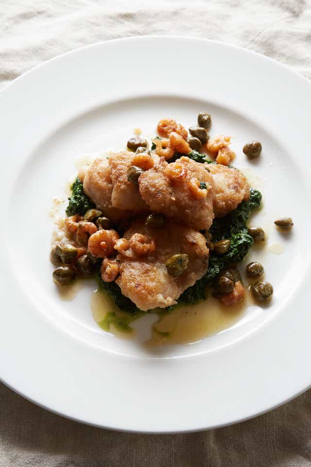 Monkfish cheeks with creamed spinach, browned shrimps and capers