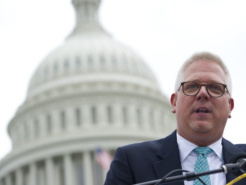 Conservative radio and television commentator Glenn Beck speaks to a rally of Tea Party members as they protest against the Internal Revenue Service (IRS) targeting of the Tea Party and similar groups during a rally called 'Audit the IRS' outside the US C