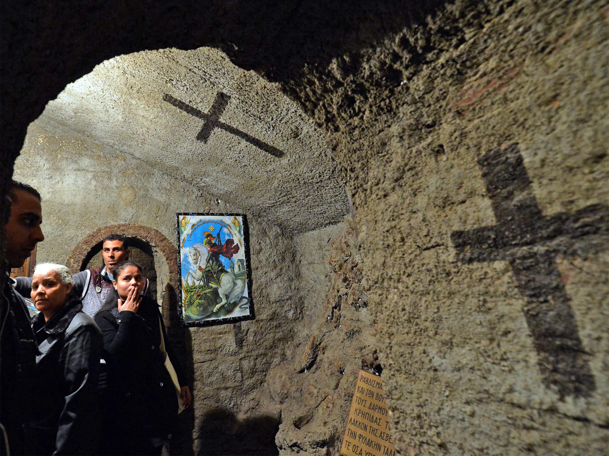 Battlefields of belief: Egyptian Coptic Christians visiting a church