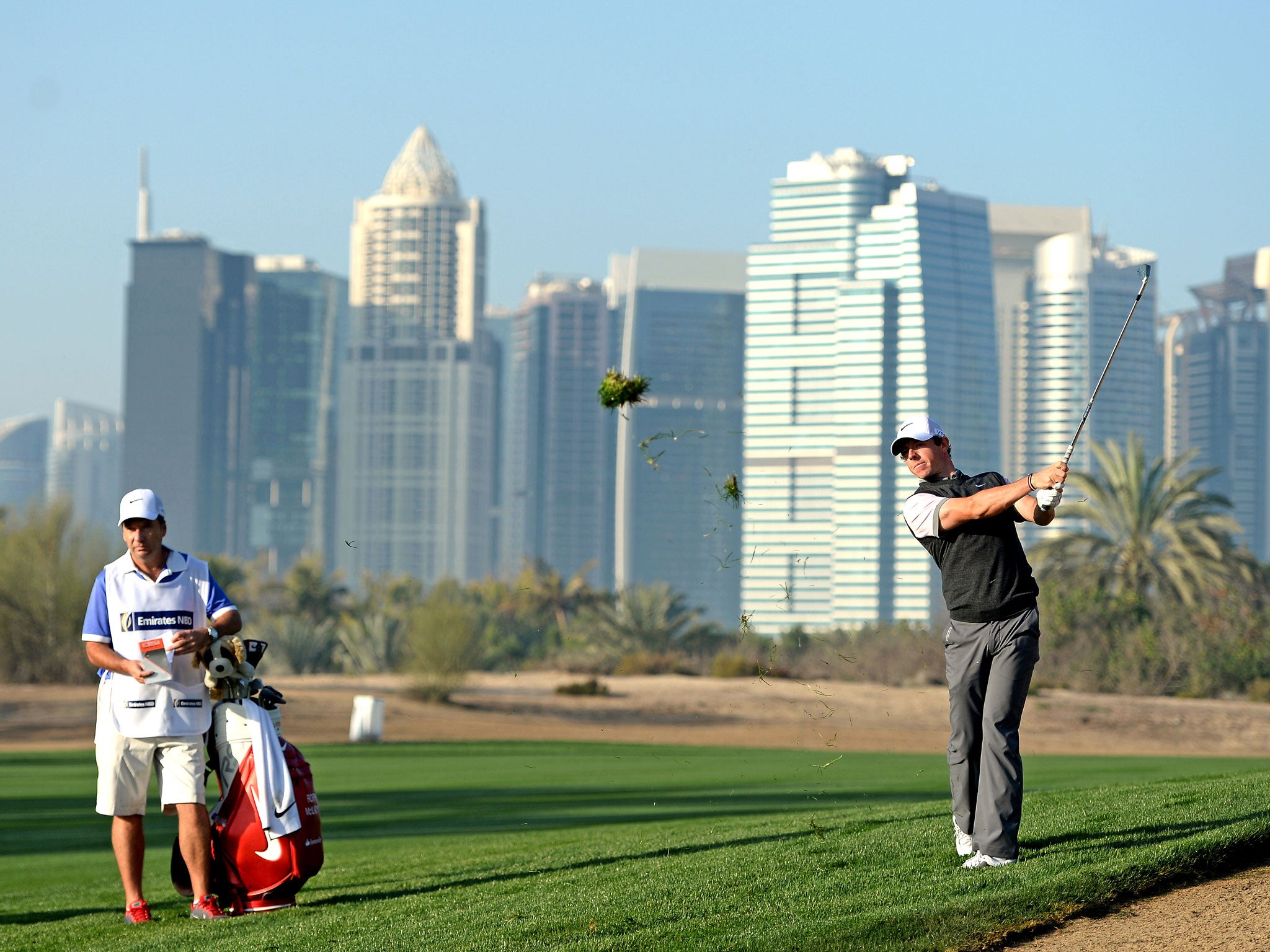 Rory McIlroy plays a shot on the 13th during the pro-am event ahead of the Dubai Desert Classic