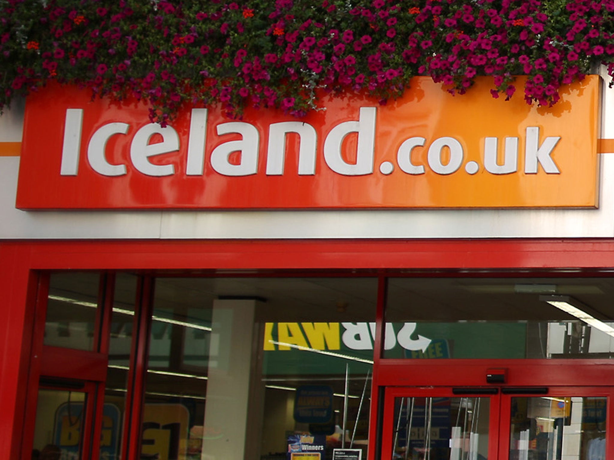 Charges against three men accused of stealing from waste-bins outside an Iceland store in London have been cleared by the CPS.