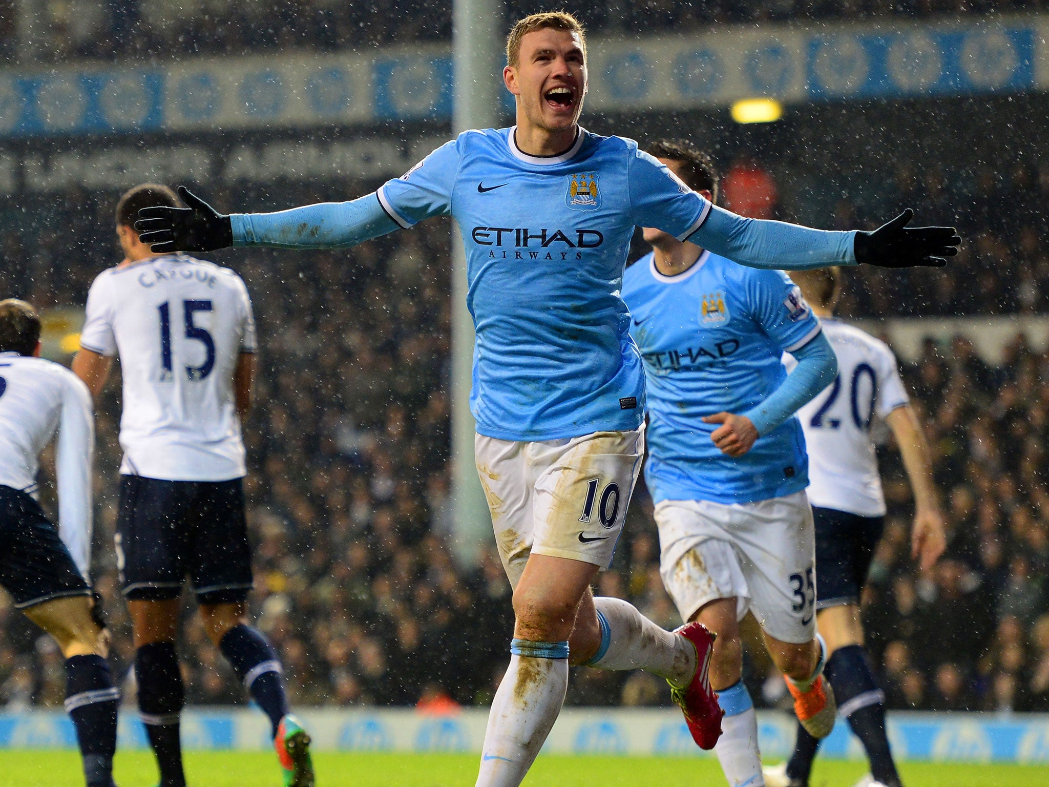 Edin Dzeko of Manchester City celebrates scoring their third goal