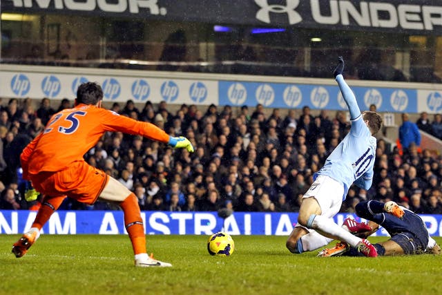Edin Dzeko earns a penalty despite Tottenham defender Danny Rose winning the ball