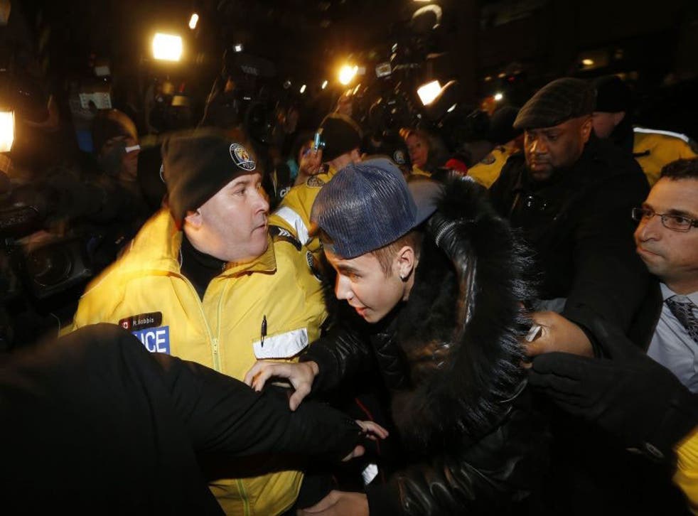 Justin Bieber arrives at a police station in Toronto