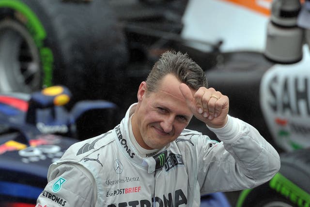 Michael Schumacher gives the thumbs up after qualifying first in Monaco