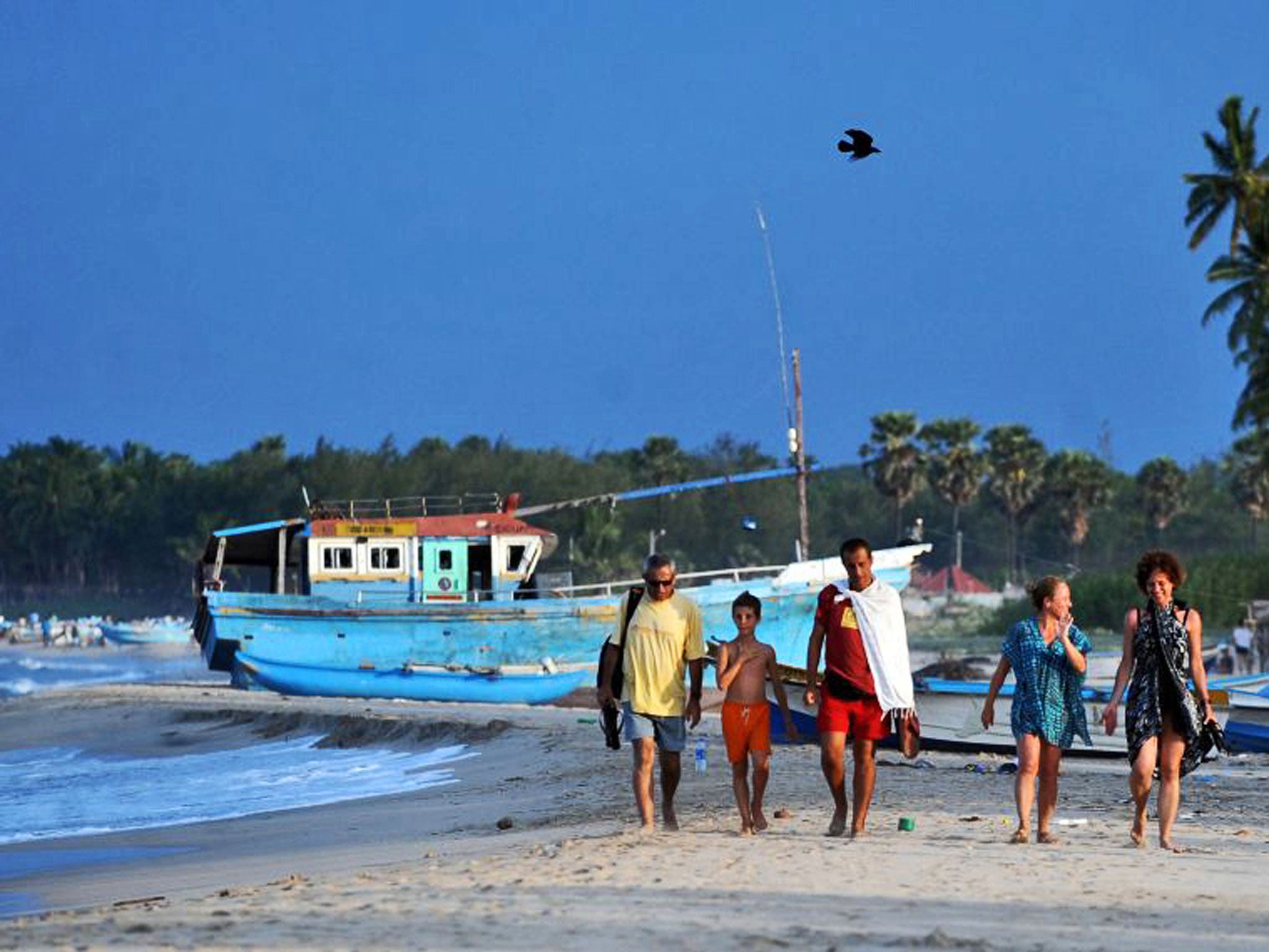 Shore thing: tourists on the beach in Trincomalee