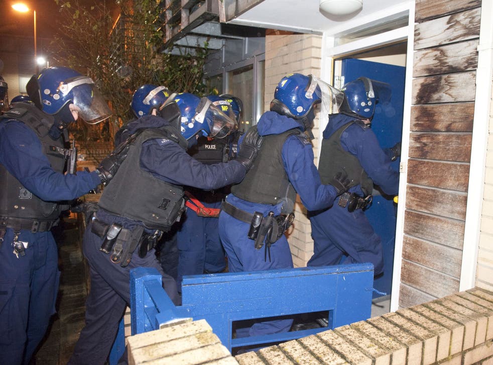 Metropolitan Police of officers entering a property in Marcella Road, SW9, as police targeted a notorious gang in a series of early morning raids across the UK