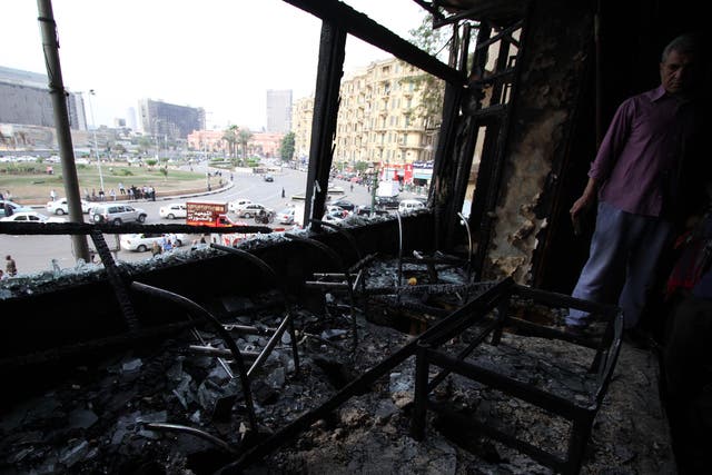 The fire-bombed offices of Al Jazeera in Cairo in November 2012. The Qatari satellite news channel was, to many, a biased supporter of the Muslim Brotherhood's rise to power 