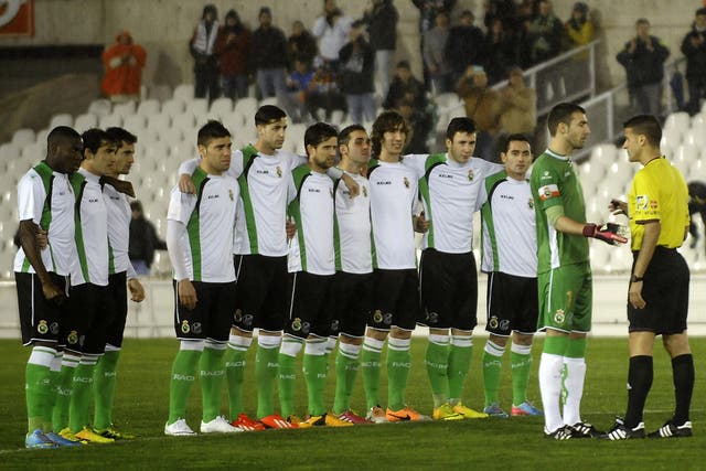 Racing Santander speak to the referee after refusing to contest their Copa del Rey quarter-final due to unpaid wages