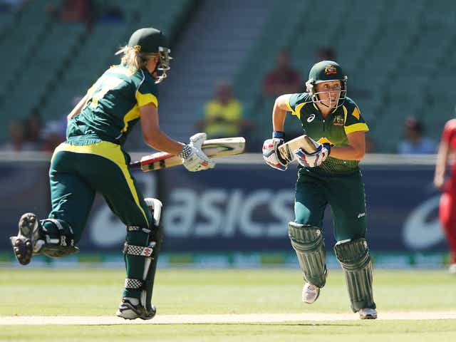 Alyssa Healy (R) of Australia runs between wickets during game two of the International Twenty20 series between Australia and England at the MCC