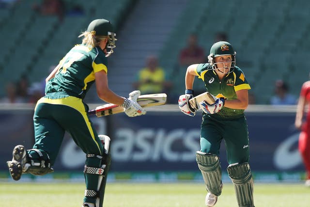 Alyssa Healy (R) of Australia runs between wickets during game two of the International Twenty20 series between Australia and England at the MCC