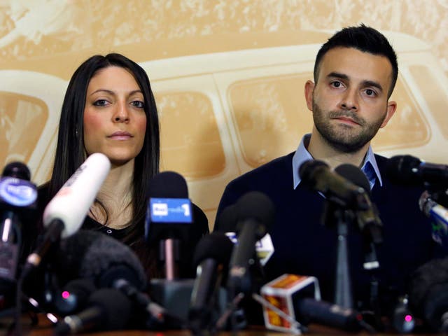 Stephanie Kercher (L) and Lyle Kercher, the sister and brother of murdered British student Meredith Kercher, attend a news conference in Florence   